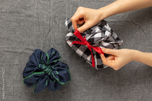 Christmas gifts wrapped in fabric. Xmas presents.