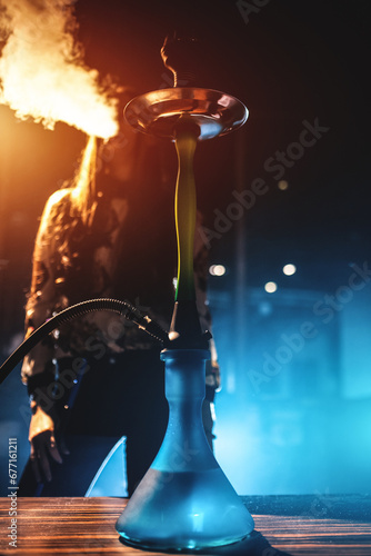 hookah in club with girl on background