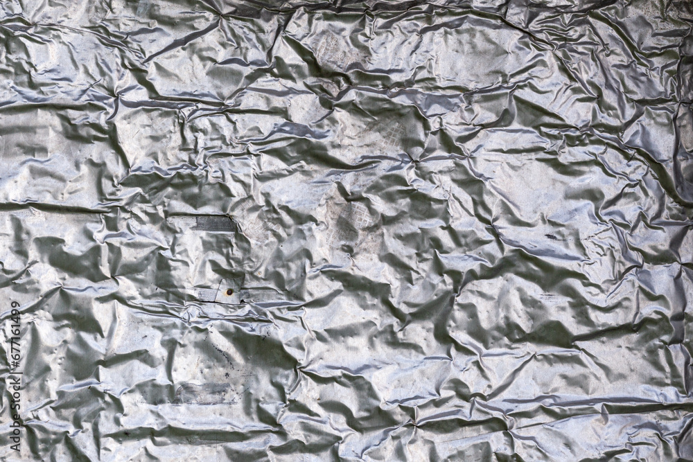 crumpled thick aluminum foil wall insulation surface texture and background