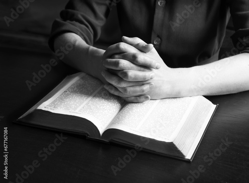 Woman's hands holding a bible