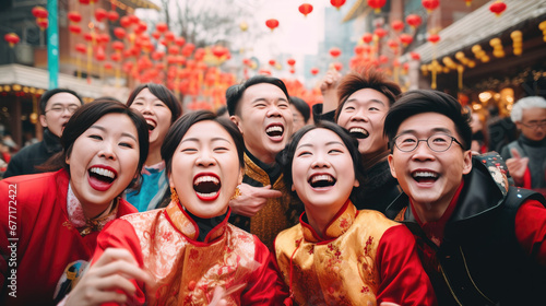 Happy Asian people with Chinese traditional clothing in Chinese new year street