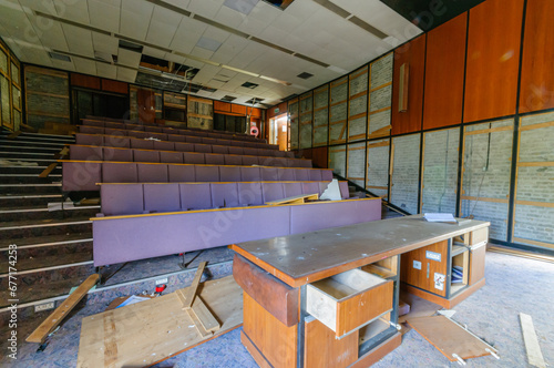 Derelict abandoned lecture theatre in an old college university training department.