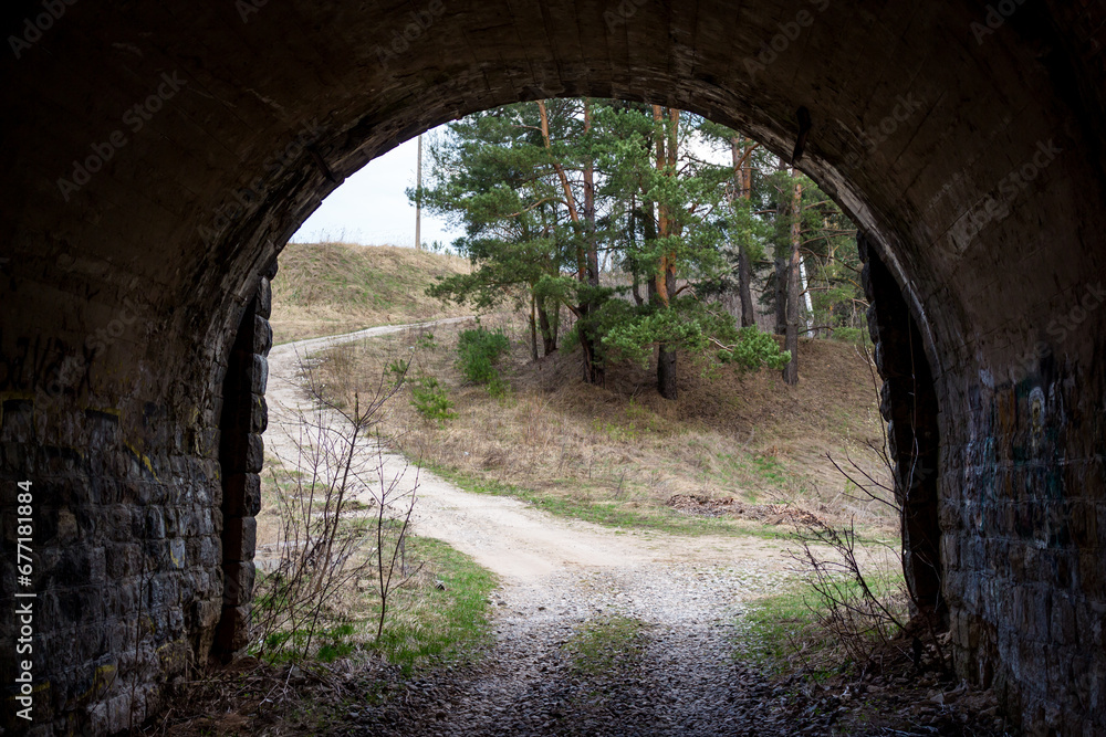 Exit from the old road tunnel under the railway embankment