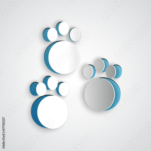 Paper cut Paw print icon isolated on grey background. Dog or cat paw print. Animal track. Paper art style. Vector