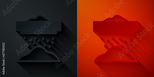 Paper cut Sifting flour, cereals or powdered sugar through sieve icon isolated on black and red background. Paper art style. Vector