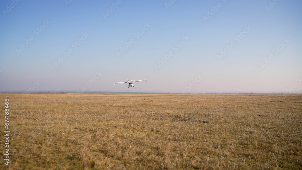 Gender reveal party. Airplane over a field with blue smoke. Gender party with airplane and blue smoke. Gender reveal party. Airplane over a field with blue smoke. Gender party with airplane and blue smoke.