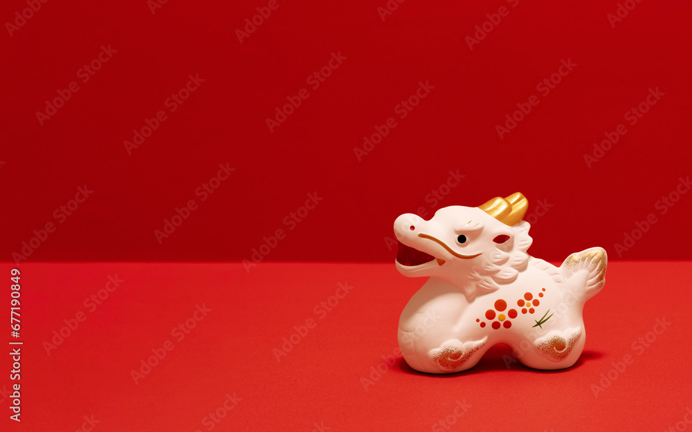 Japanese new year material. Zodiac dragon on red background. 日本のお正月素材。赤色背景上の干支の辰。 Japanese new year material. Zodiac dragon on red background. 日本のお正月素材。赤色背景上の干支の辰。