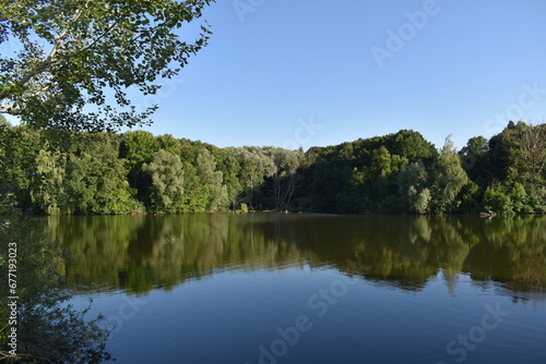 Natural reflections, mirror effect on water, lake in Poltava region, Ukraine