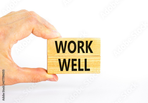 Work well symbol. Concept words Work well on beautiful wooden block. Beautiful white table white background. Businessman hand. Business marketing, motivational work well concept. Copy space.