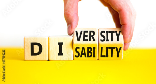 DEI Diversity or disability symbol. Concept words Diversity disability on wooden block. Beautiful yellow table white background. Businessman hand. Business diversity disability concept. Copy space.