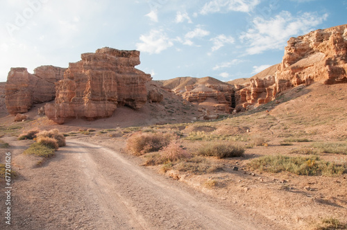 Evening landscape view of Charyn canyon in the Almaty region of Kazakhstan with a gravel road in the foreground