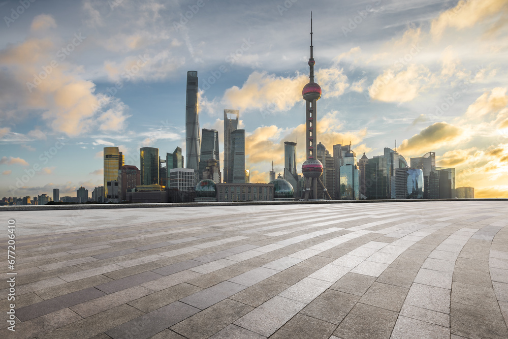 Fototapeta premium Square floor and city buildings skyline in Shanghai at sunset