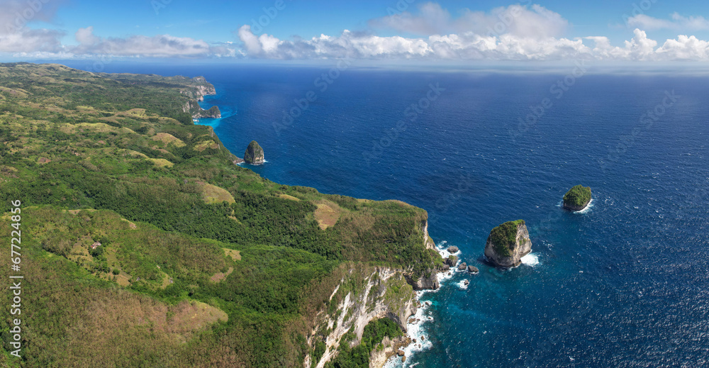 Panoramic aerial view of South Coast and Manta Point (Sekar Kuning) on sunny day. Nusa Penida Island, Indonesia.