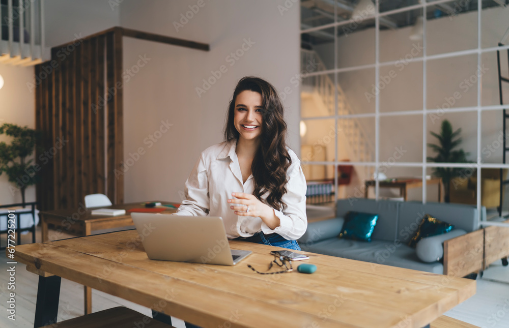 Female blogger sitting at table Female blogger sitting at table