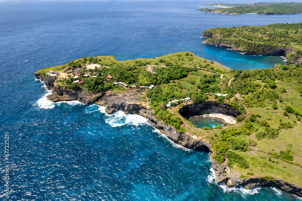 Aerial view of Broken Beach and Angel's Billabong on sunny day. Nusa Penida Island, Indonesia.