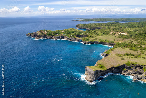 Drone view of Dolphin Bay, Broken Beach and Angel's Billabong on sunny day. Nusa Penida, Indonesia.