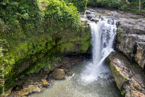 Drone view of Tegenungan Waterfall on sunny day. Bali  Indonesia.