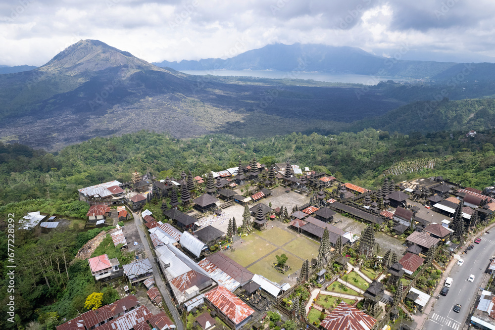 Drone view of Pura Ulun Danu Batur hindu temple, Mount Batur and Lake Batur. Kintamani, Bali, Indonesia.