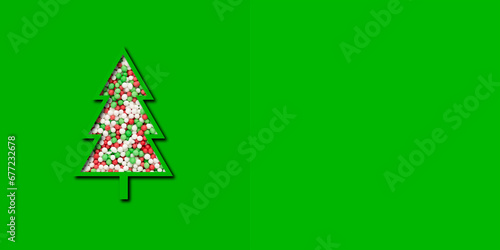 christmas card with a cut out christmas tree full of colorful sweet sugar sprinkles isolated on green background
