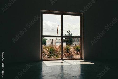 Empty loft interior of a building with a view of the city of Marfa, Texas photo