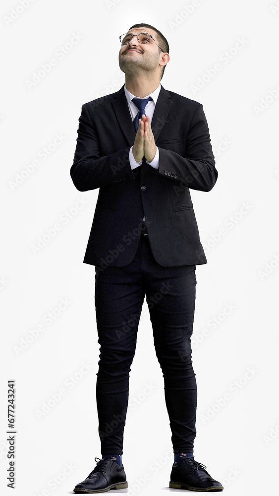 young man in full growth. isolated on a white background cupped hands together young man in full growth. isolated on a white background cupped hands together