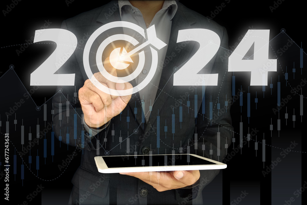 person holding tablet and touching touch screen having 2024 showing