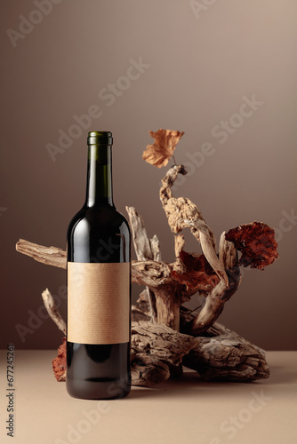 Bottle of red wine with a composition of old wood.