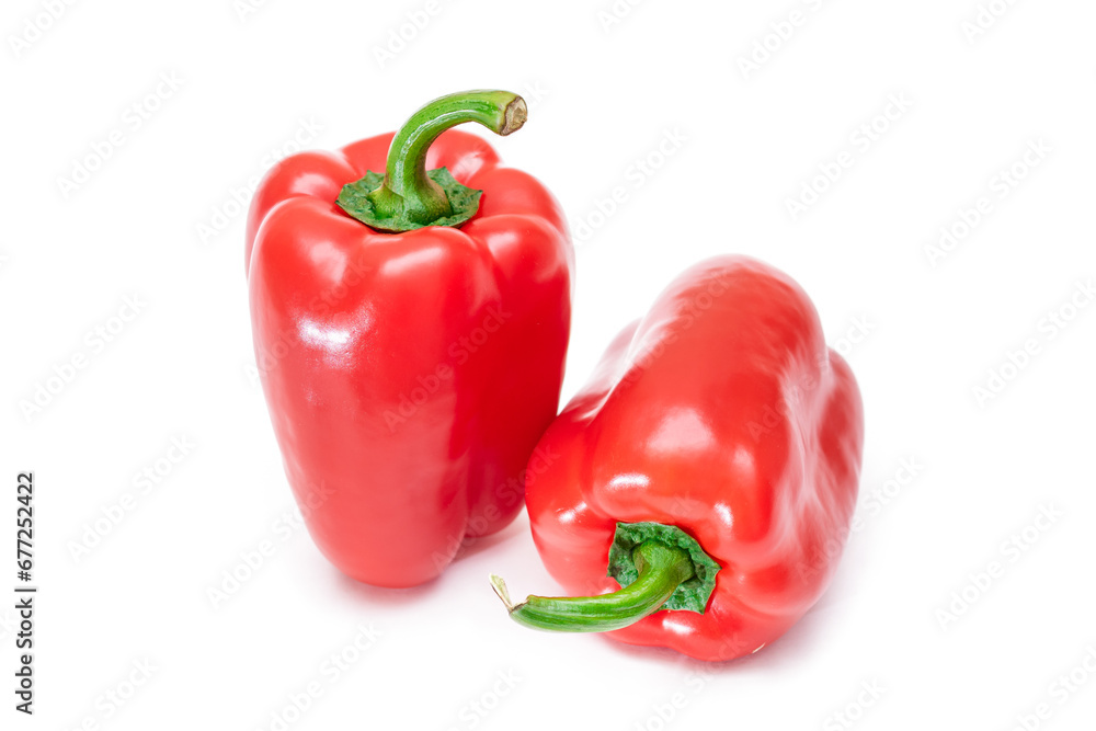 Two Fresh Red Sweet Bell Peppers Isolated on White Background