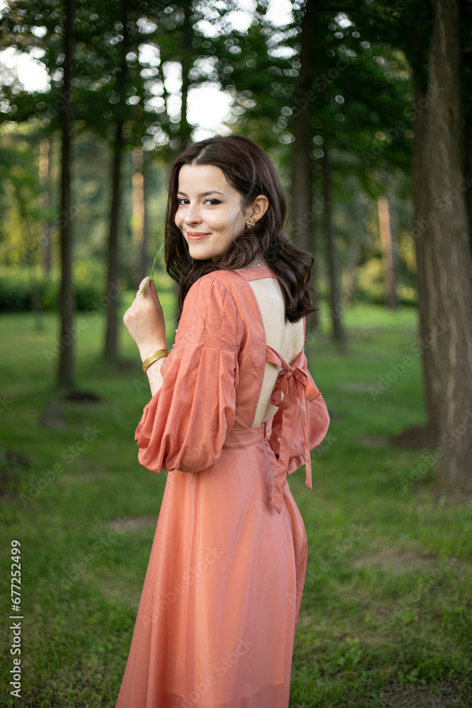 Image of a fashion brunette smiling young woman outdoorportrait. Image of a fashion brunette smiling young woman outdoorportrait.