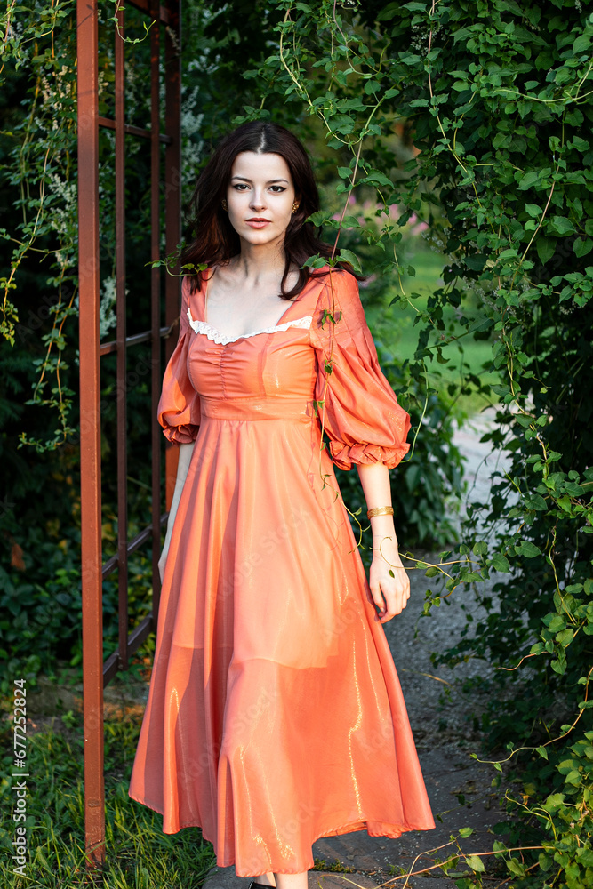Fototapeta premium Portrait of a woman in a red dress