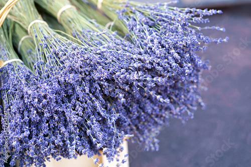 Nice. French market. Close up view of dried lavender flowers with bracts. Light purple colour. Pattern of small natural violet elements. Aromatic mediterranean product. photo
