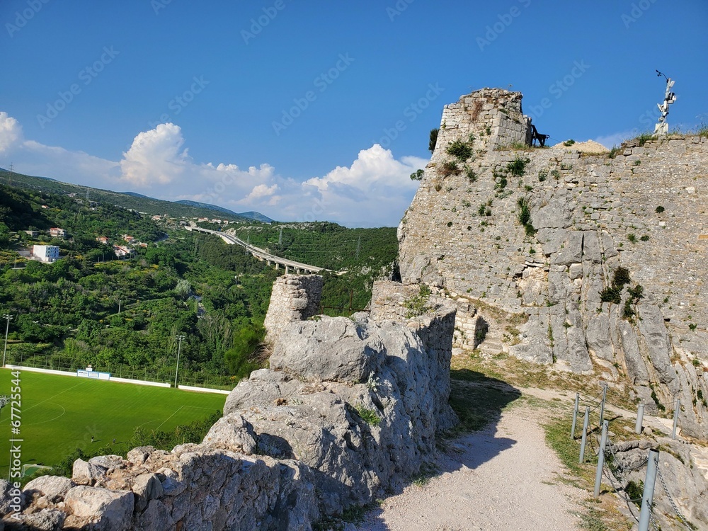 Walls of Fortress Klis before the greenery on a sunny day