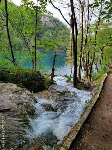 Vertical view of water flowing down the cascade in Plitvice lake national park photo