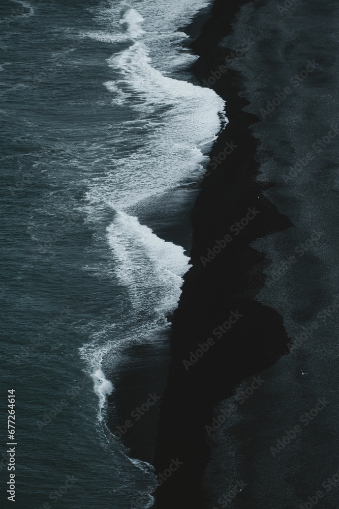 Vertical aerial view of the Iconic Black Beach Of Iceland