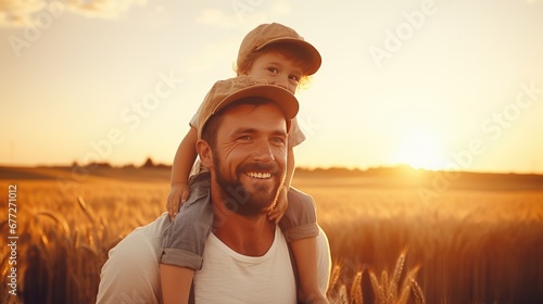 happy father farmer carries son child boy sunset. child sits happily his father shoulders wheat field photo