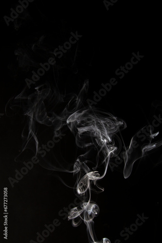 White Smoke Cigarette in Dark Background