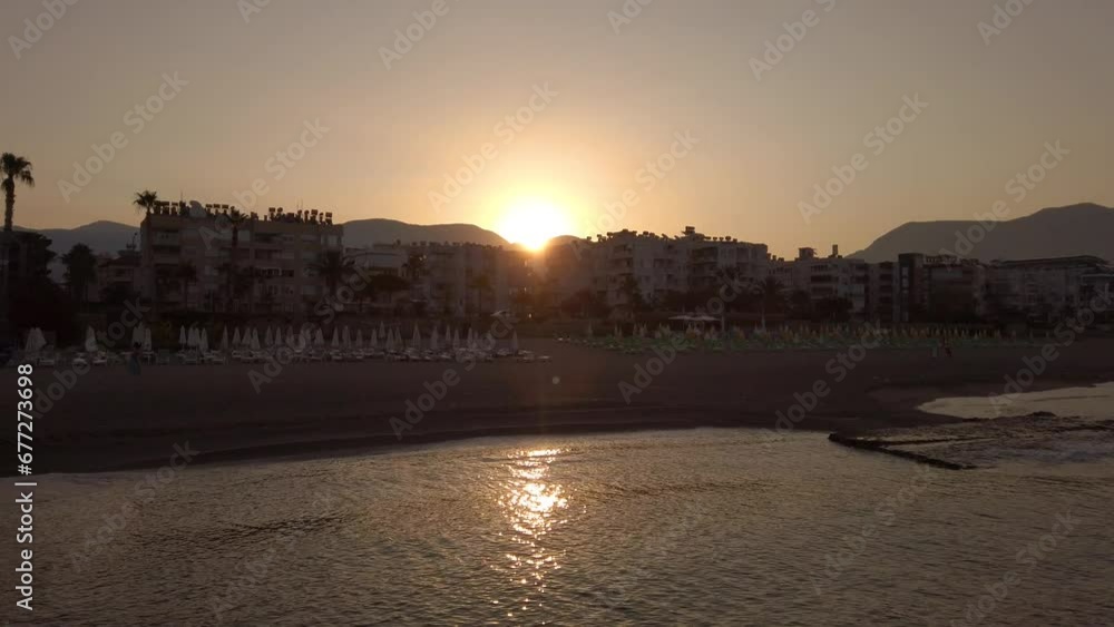 Coastline of Turkish beach in Alanya city at sunrise in early morning. Travel or vacation concept Coastline of Turkish beach in Alanya city at sunrise in early morning. Travel or vacation concept