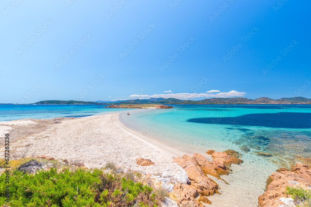 A man sitting at Passetto beach, Tavolara island, Olbia area, Sardinia, Italy, Europe
