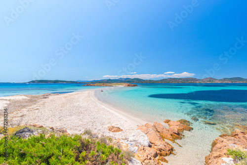A man sitting at Passetto beach, Tavolara island, Olbia area, Sardinia, Italy, Europe