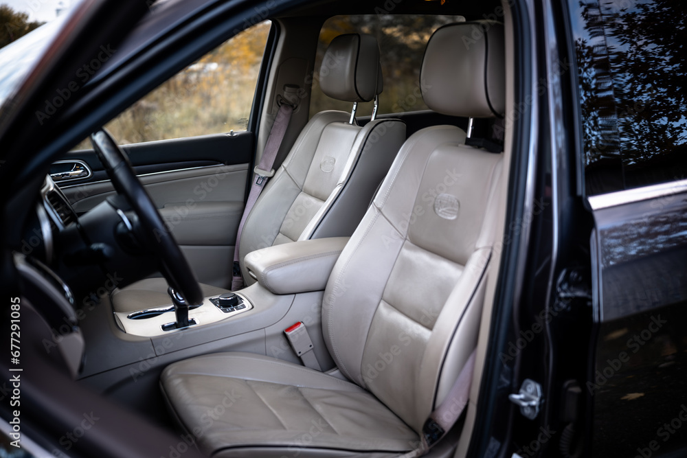 Light brown leather seats in a car Light brown leather seats in a car