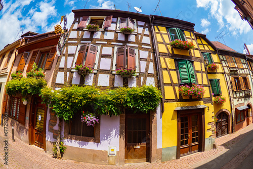 the colorful half timbered building in the streets of the beautiful Alsace village Riquewihr photo