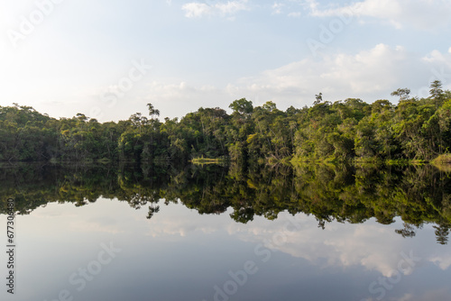 Amazon rainforest reflection: Pristine landscape mirrored in Pracupi river waters in the Marajo archipelago region © Tarcisio Schnaider