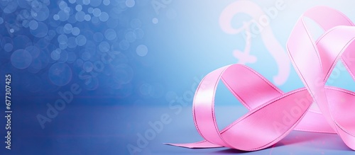 Breast cancer symbol on blue backdrop close up view Copy space image Place for adding text or design