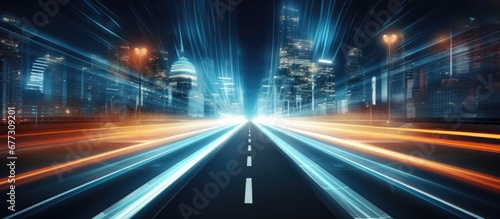 Abstract urban city street at night with modern buildings illuminated Futuristic light trails from camera zooming create unique background effect Copy space image Place for adding text or desig