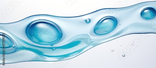 Blue serum toner in a gel like texture a moisturizer with bubbles displayed on a white background Copy space image Place for adding text or design photo