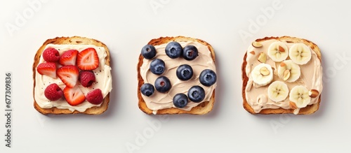 Assorted sweet toast chocolate banana peach cream cheese strawberry peanut butter blueberry cream cheese White background from above Copy space image Place for adding text or design photo