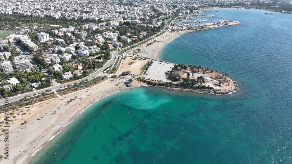 Aerial drone photo of seaside touristic area with paradise beaches and modern architecture of Glifada, Athens riviera, Attica, Greece