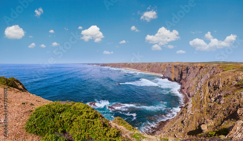 Summer Atlantic ocean coast landscape with sandy beach (Aljezur, Algarve, Portugal). 