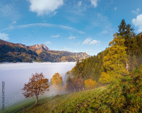 Peaceful misty autumn morning mountain view from hiking path from Dorfgastein to Paarseen lakes, Land Salzburg, Austria. photo