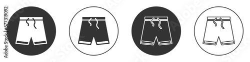 Black Swimming trunks icon isolated on white background. Circle button. Vector